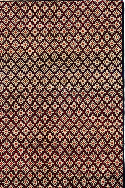 Image of "The Virtue Weave" rug showcasing intricate design and rich cultural motifs.