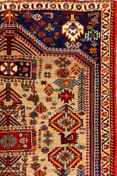 Image showcasing a traditional motifs rug with intricate design and rich colors.