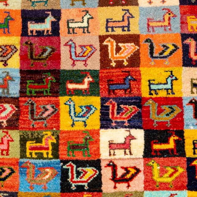 Image showing a vibrant Gabbeh rug with geometric patterns and a delightful array of colors.