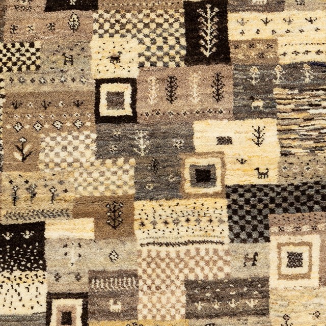 Image showing an elegant Gabbeh rug with earthy colors and traditional Persian motifs.