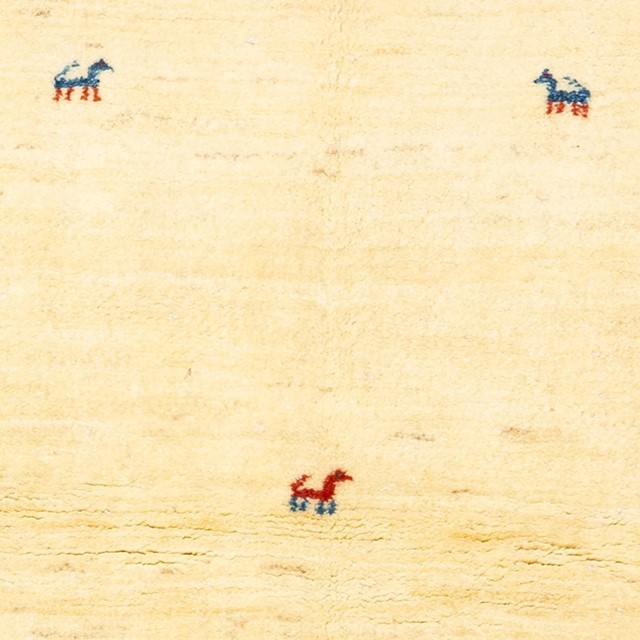 Image showing the "Savannah Horses" Gabbeh rug with beige field and rich red frame.